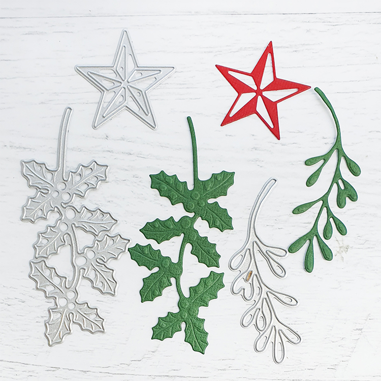 <p>You punch the twigs out of Christmas greenery and stick this over the part where you linked the star to the card shape.</p>